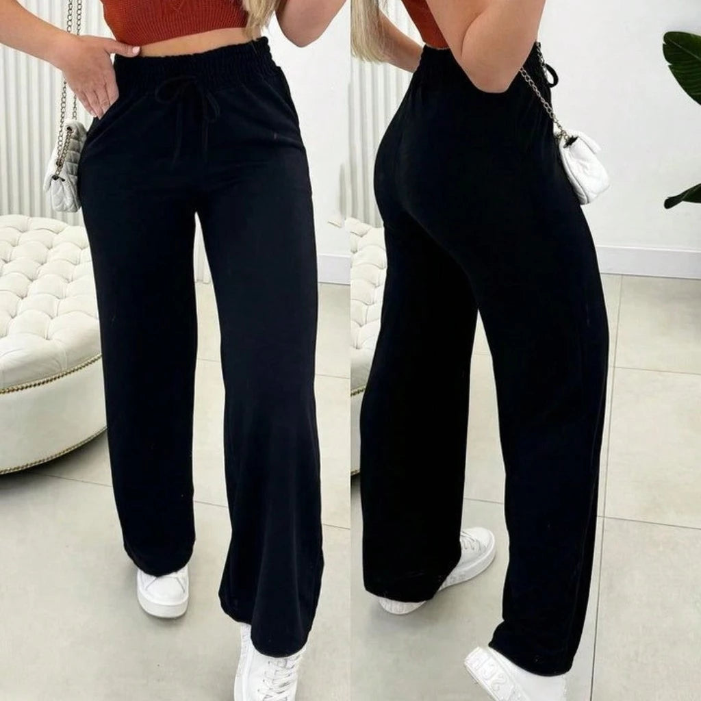 Detalhe da cintura alta e modelagem pantalona da calça Aurora em lanzinha